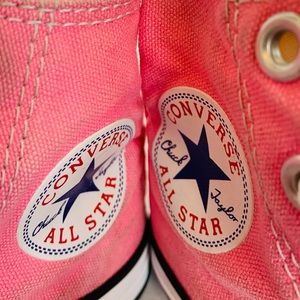 Pink high top Chuck Taylor’s